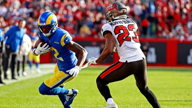 Los Angeles Rams wide receiver Van Jefferson (12) runs the ball against Tampa Bay Buccaneers cornerback Sean Murphy-Bunting (23) during the first half in a NFC Divisional playoff football game at Raymond James Stadium